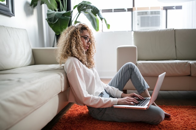 young woman browsing an eCommerce website on her laptop